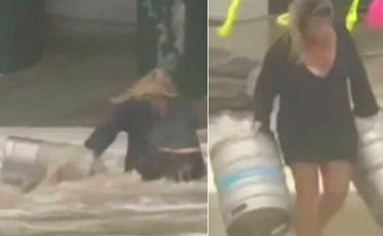 Mulher se joga em mar agitado para salvar barris de cerveja arrastados durante tempestade 